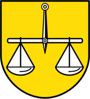 Das Bild zeigt ein Wappen mit einer schwarzen Waage auf gelbem Hintergrund.
